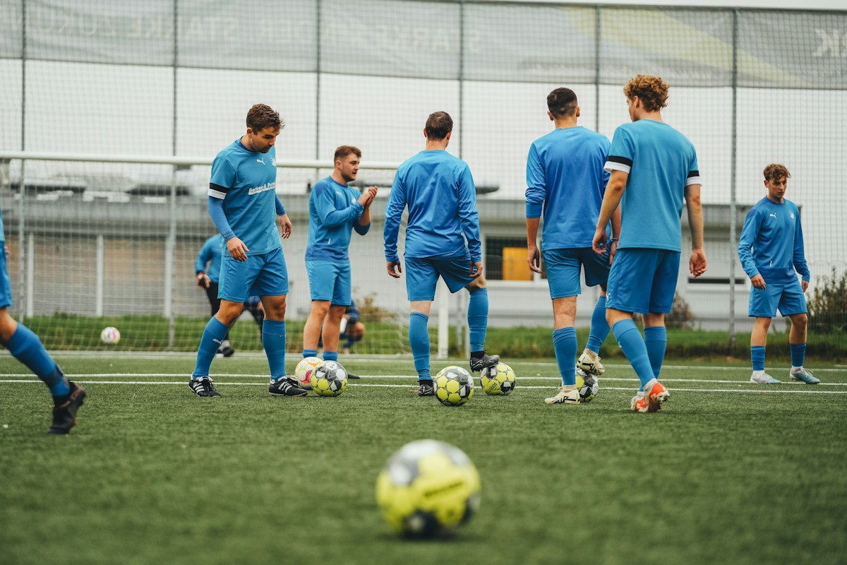 Football squad preparing together on the training pitch